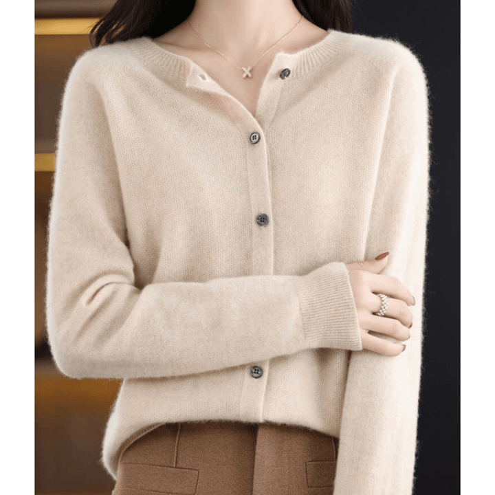 Warm women's O-neck sweater, soft cashmere-like wool blend texture. Ideal for everyday comfort.