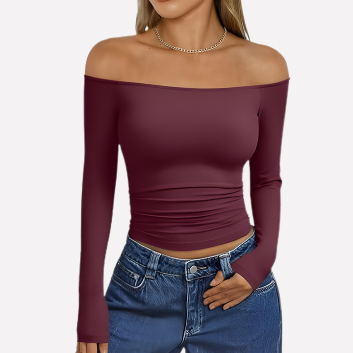 Soft fabric women's off-shoulder long sleeve top, featuring a flattering neckline and comfortable sleeves.