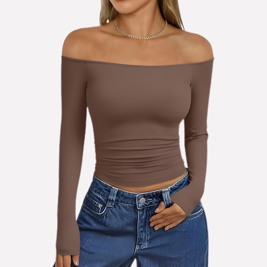 Elegant women's off-shoulder long sleeve top, a comfortable and fashionable addition to any wardrobe.