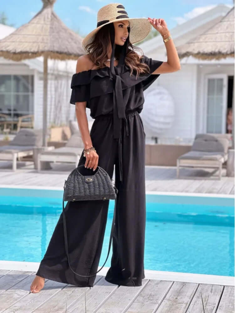 Fashionable off-shoulder wide-leg jumpsuit for women, featuring ruffled detail for a stylish, versatile look.