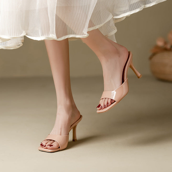 Women's open-toe slip-on mules with a trendy square heel, ideal for versatile summer fashion.
