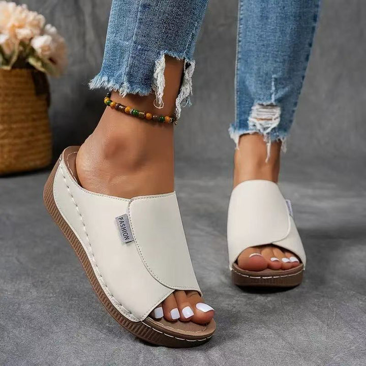 Stylish women's open toe wedge sandals; easy slip-on design for elegant casual summer wear.