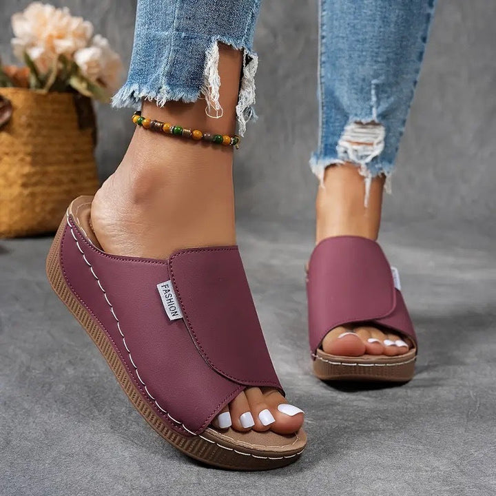Warm weather women's open toe slip-on wedge sandals, providing comfort and style.