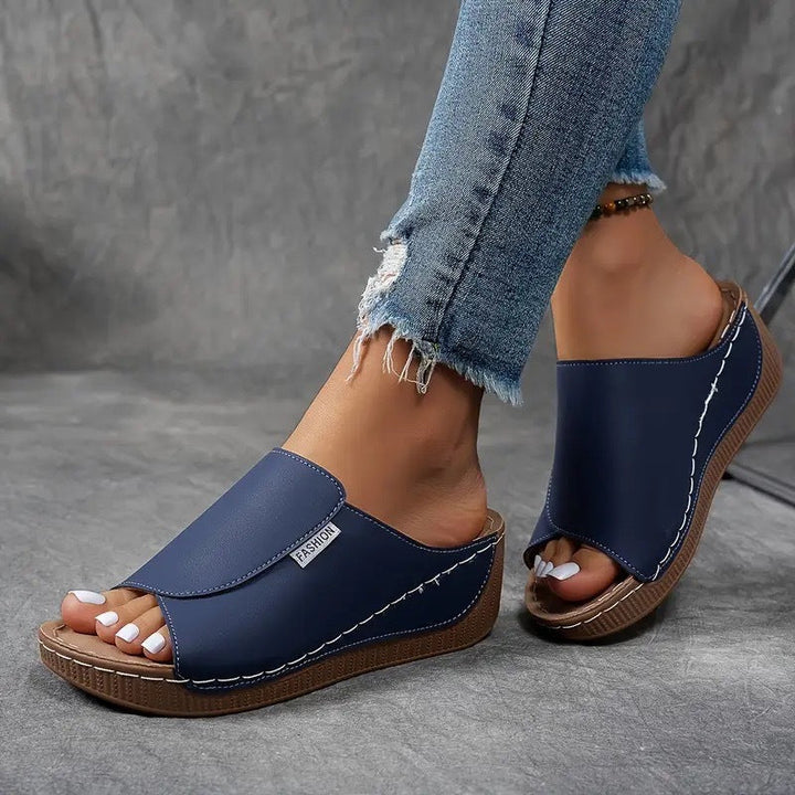 Chic women's open toe slip-on wedge sandals, essential summer footwear for comfort and style.