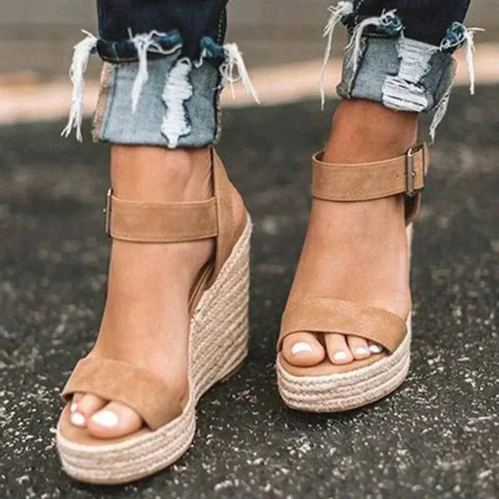 Women's open-toe wedge espadrilles with ankle strap, perfect for summer casual wear. Fashionable and comfortable.