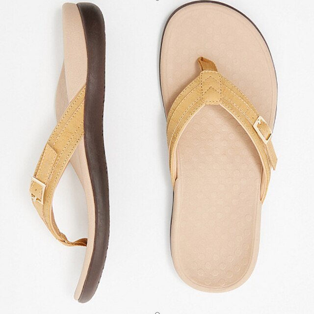 Pair of women's comfortable orthopedic flip flops in a neutral color, perfect for beach or casual wear.