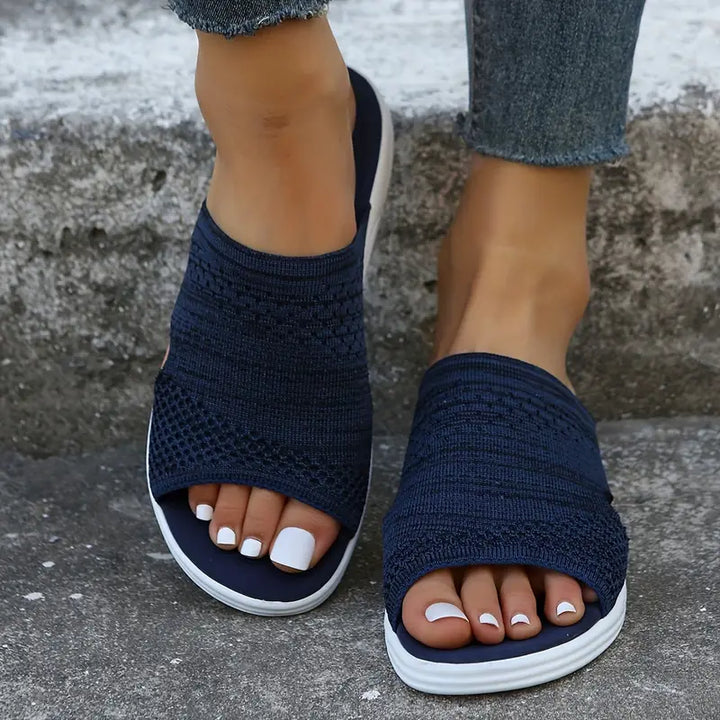 Close-up of knit texture on women's open-toe comfort sandals, ideal for summer