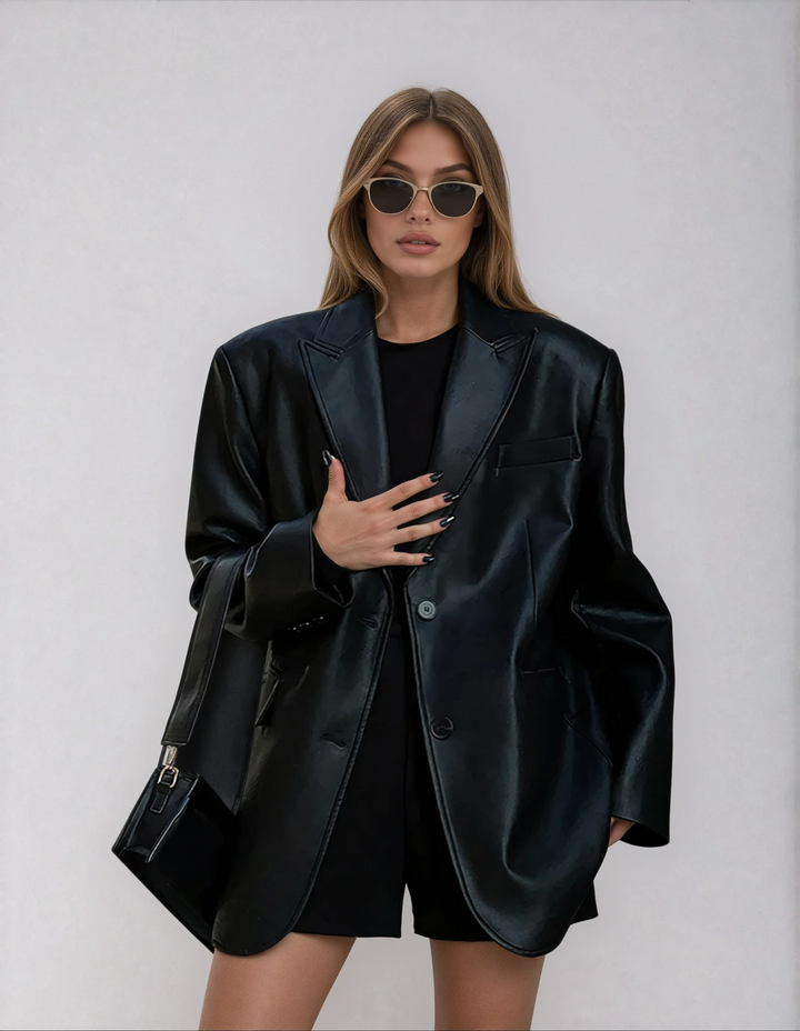 Women's oversized black statement blazer with chic lapel design, perfect for smart casual or fashion outerwear.
