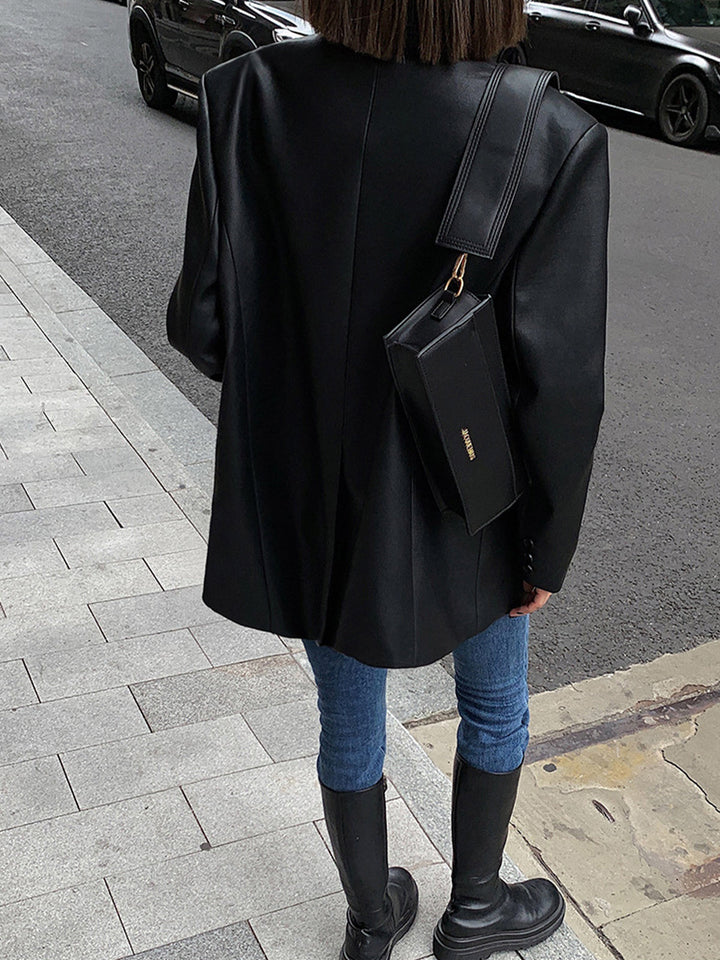 Chic brown oversized lapel blazer for women, a versatile statement jacket suitable for modern smart casual wear.