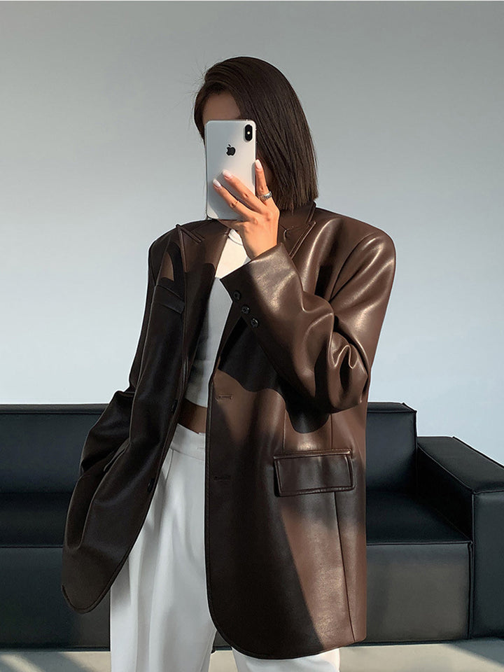 Stylish women's oversized black blazer, a modern lapel jacket and statement outerwear piece for versatile fashion.