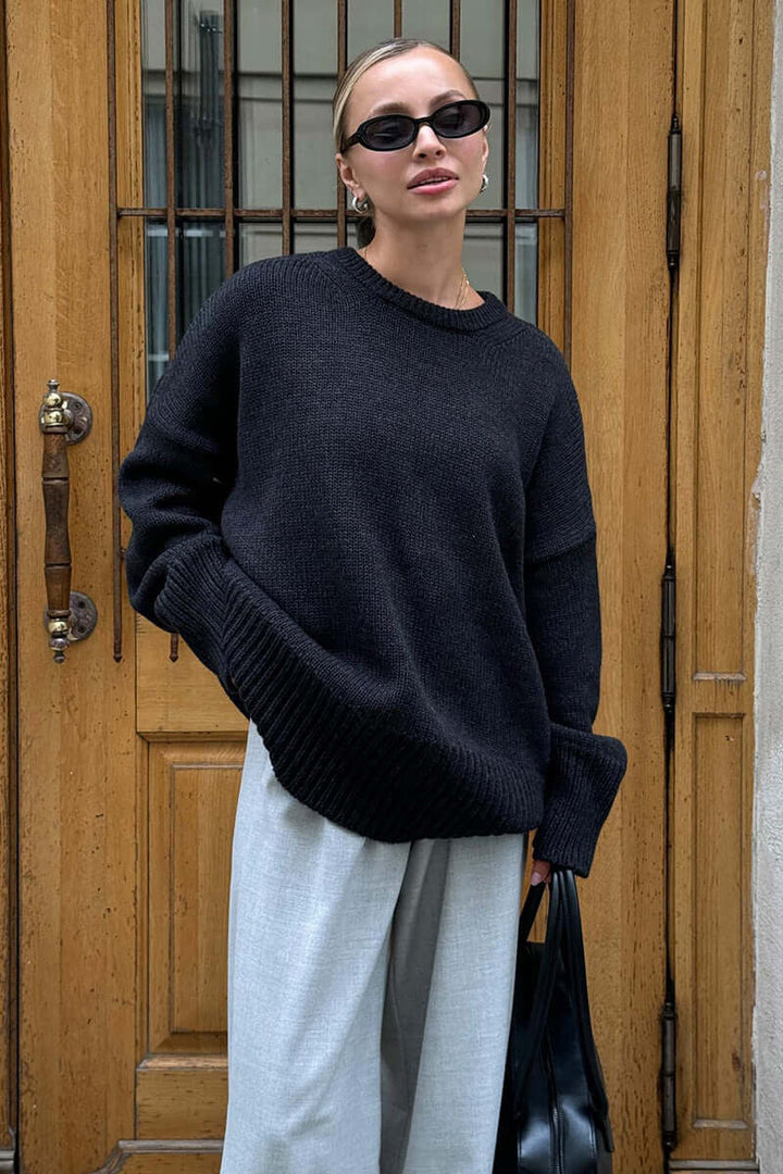 Women's oversized charcoal knitted jumper, soft & warm winter style.