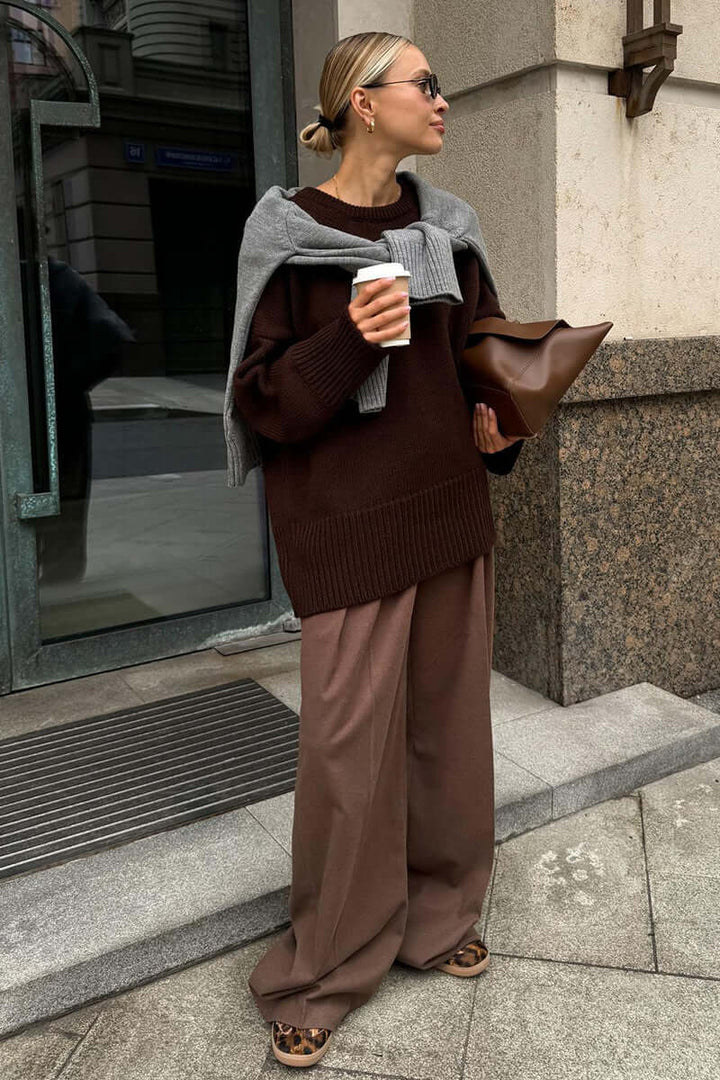 Comfortable women's charcoal knitted long sleeve sweater, relaxed fit.