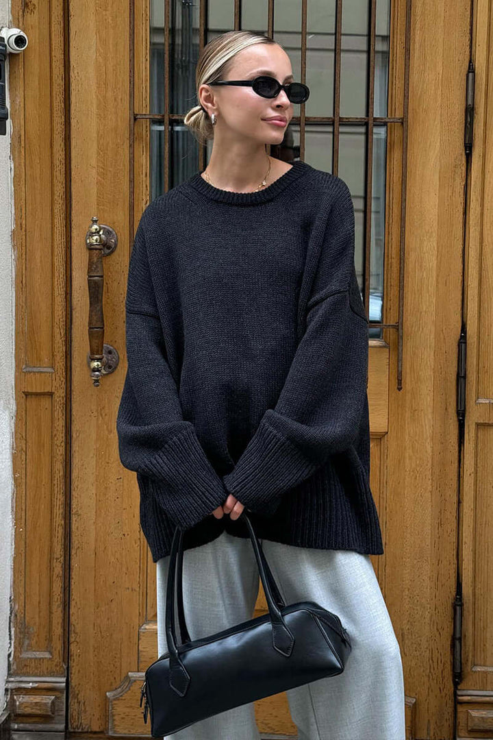 Comfortable women's charcoal knitted sweater, versatile winter fashion.