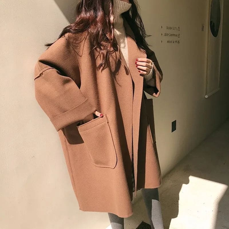 Elegant women's oversized wool blend trench coat, ideal for fall fashion, winter layering, and spring outerwear.