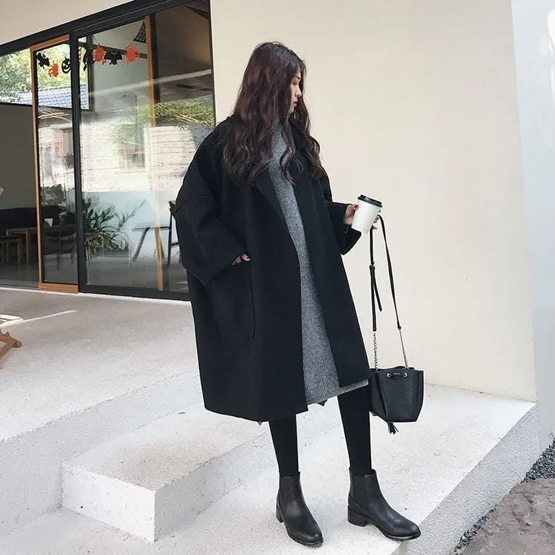 Classic oversized trench coat for women, timeless double-breasted style in a luxurious wool blend. Versatile.