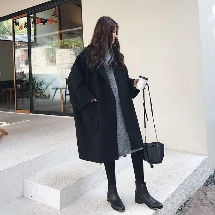 Classic oversized trench coat for women, timeless double-breasted style in a luxurious wool blend. Versatile.