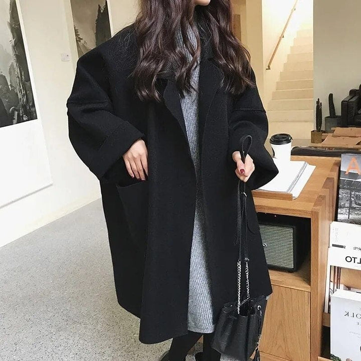 Aura women's oversized wool blend trench coat, a classic double-breasted jacket for elegant and timeless style.