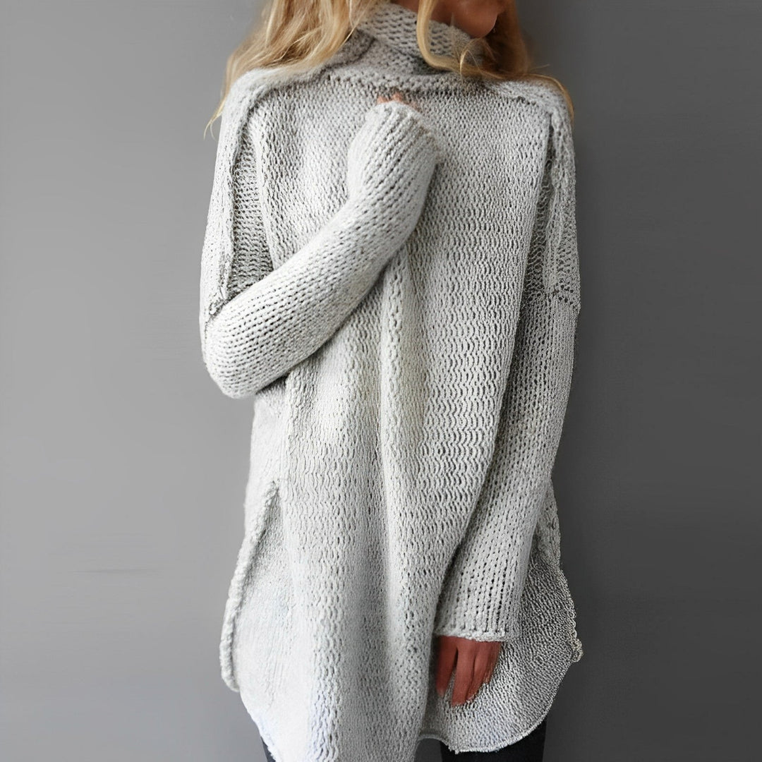 Women's oversized cozy long sweater in a relaxed fit. Comfortable winter fashion, perfect for casual, modern minimalist style.