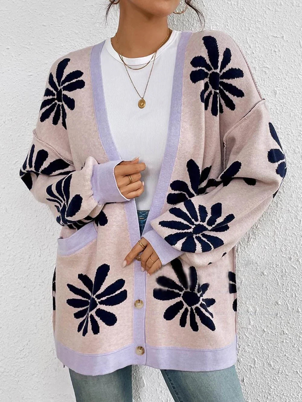 Comfortable women's oversized cardigan with a stylish floral pattern. Relaxed fit for versatile, all-season wear.