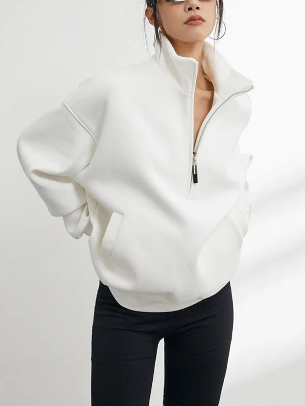 Relaxed fit women's oversized half-zip pullover hoodie, a super cozy sweater ideal for casual wear.
