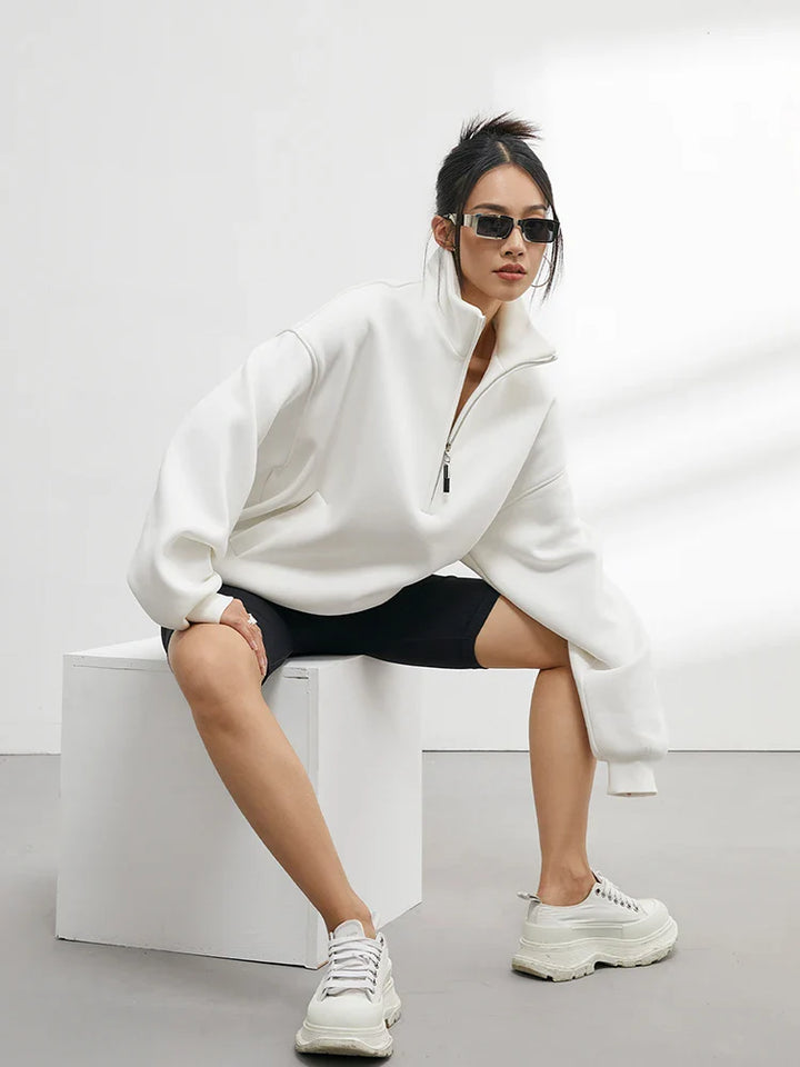 Soft women's oversized half-zip hoodie, a cozy pullover top for ultimate comfort & loungewear style.