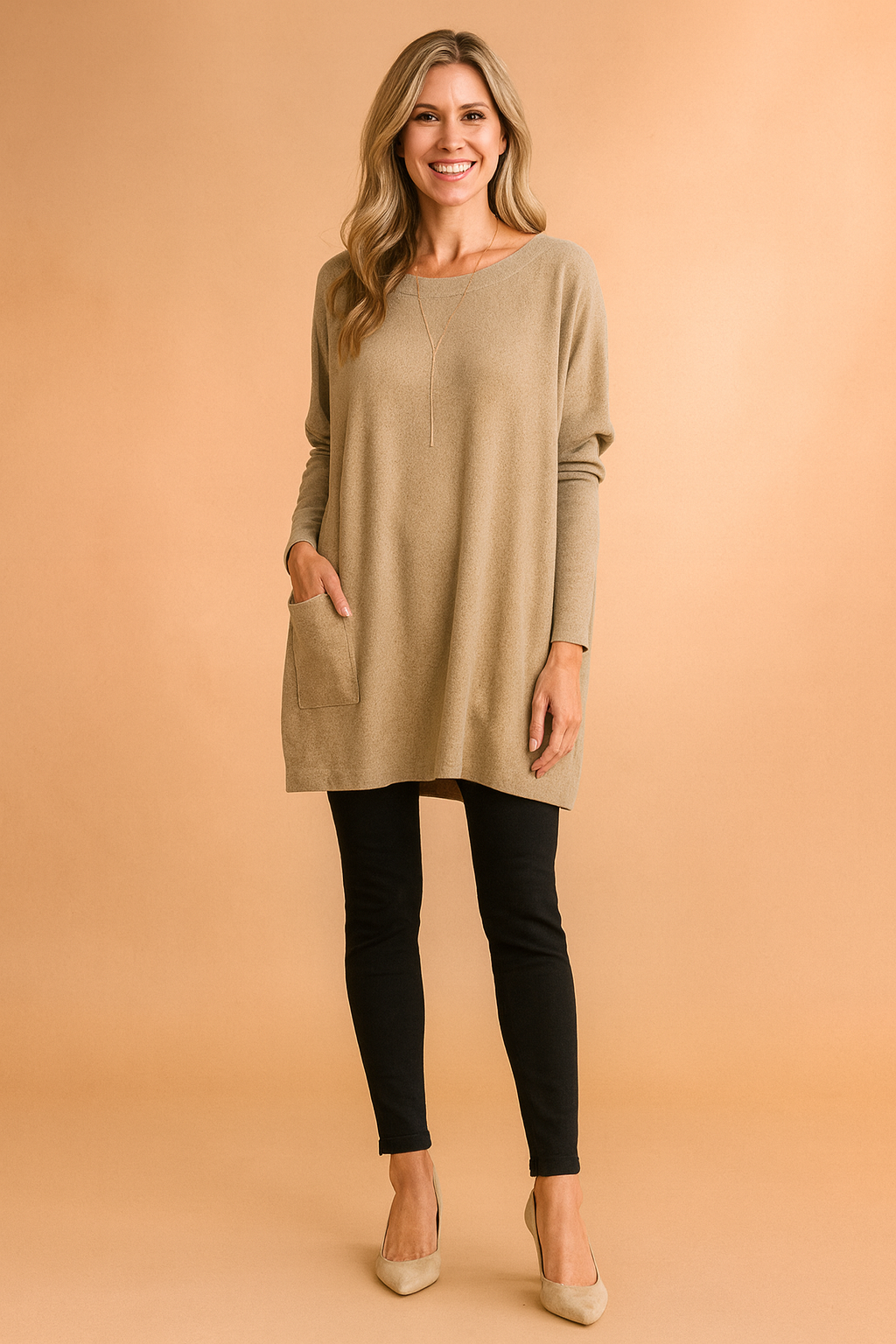 Comfy women's oversized tunic sweater with practical front pockets, ideal for relaxed casual style.