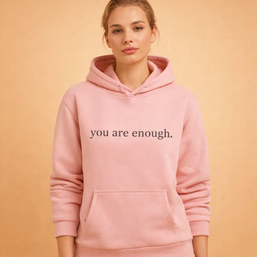 Cozy women's oversized hoodie in a dark color with an inspirational graphic, perfect for loungewear.