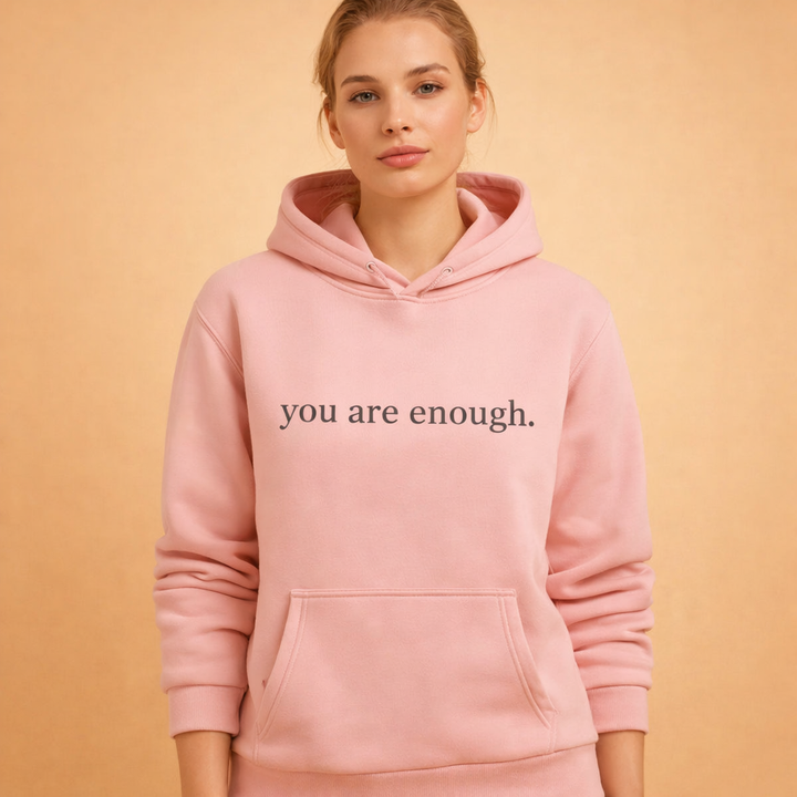 Cozy women's oversized hoodie in a dark color with an inspirational graphic, perfect for loungewear.