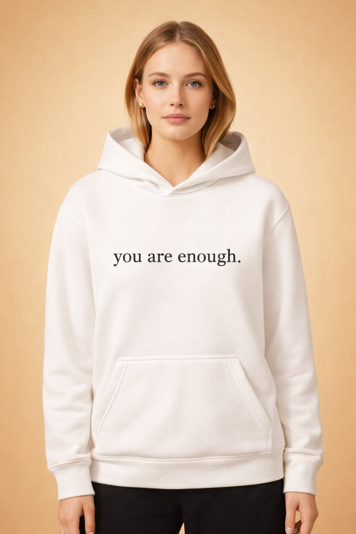 Close-up of the inspiring slogan on a comfortable women's oversized graphic hoodie.