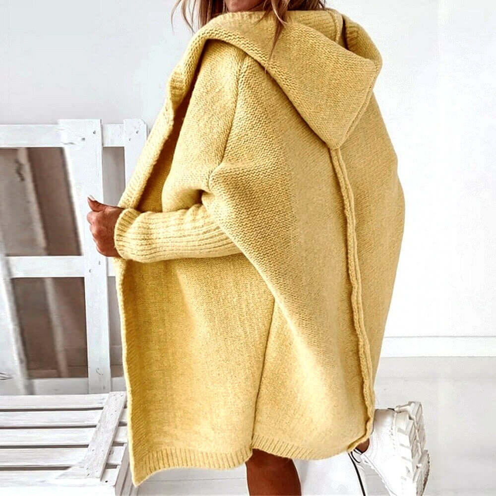 Chic women's hooded cardigan sweater in a cozy oversized knit. Essential warm layering for everyday comfort.