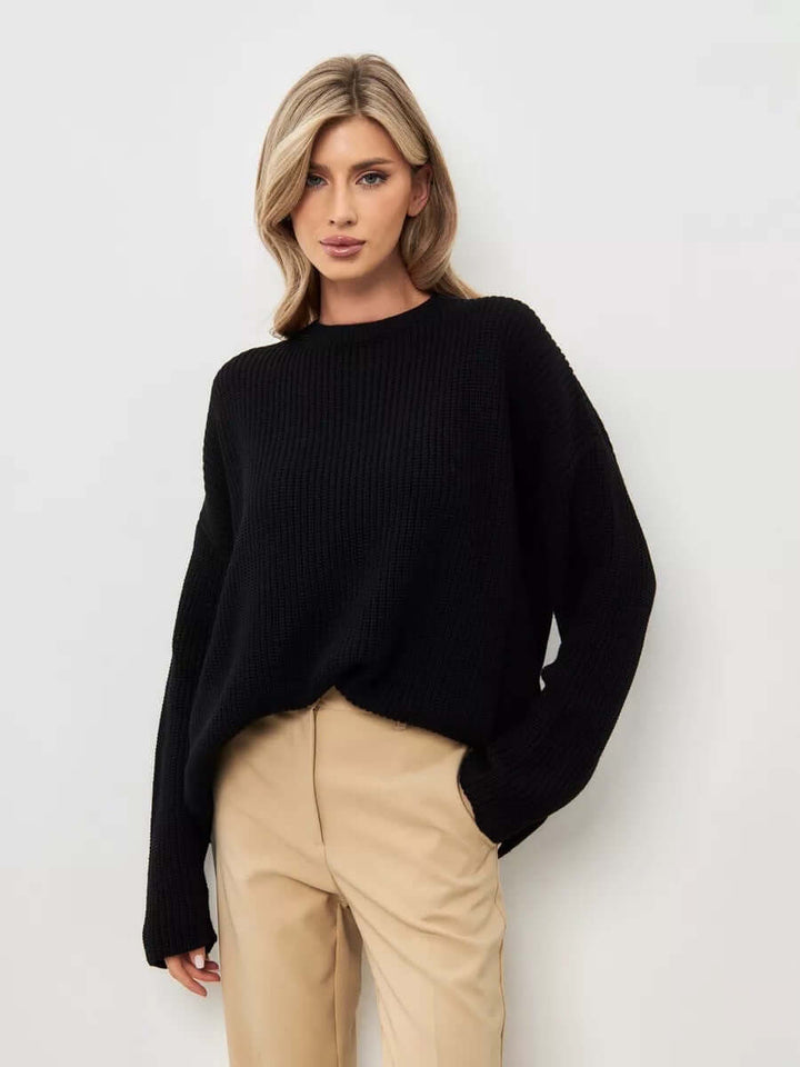 Women's oversized knit jumper, soft crew neck, perfect for relaxed casual wear & winter comfort.