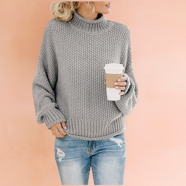Cozy chunky knit oversized turtleneck sweater for women, offering warmth & everyday comfort in winter.