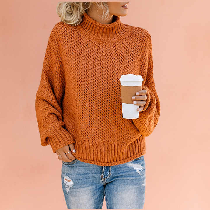 Warm women's chunky knit turtleneck sweater, an essential oversized piece for fall & winter fashion.
