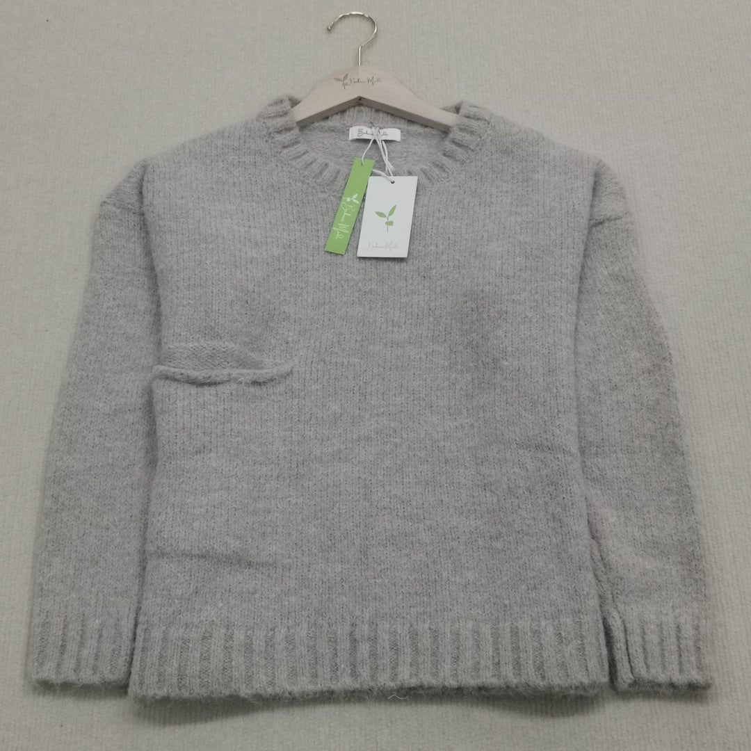 Women's knitted jumper in classic grey, relaxed fit for fall and winter comfort.