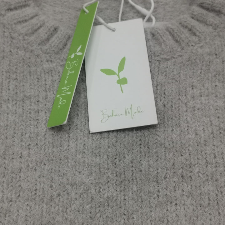 Winter comfort: women's oversized cream sweater, warm, stylish, and relaxed fit.