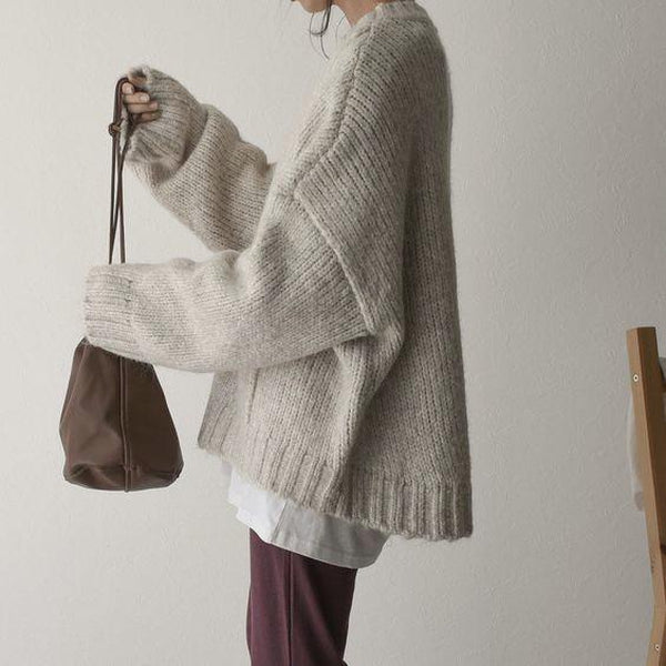 Soft knitted women's jumper, a cozy essential for fall fashion & winter style.