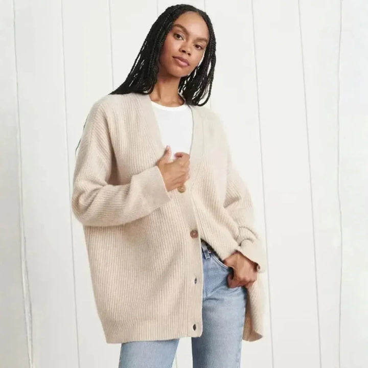 Elegant women's oversized longline v-neck cardigan, ideal for casual fall & winter fashion.