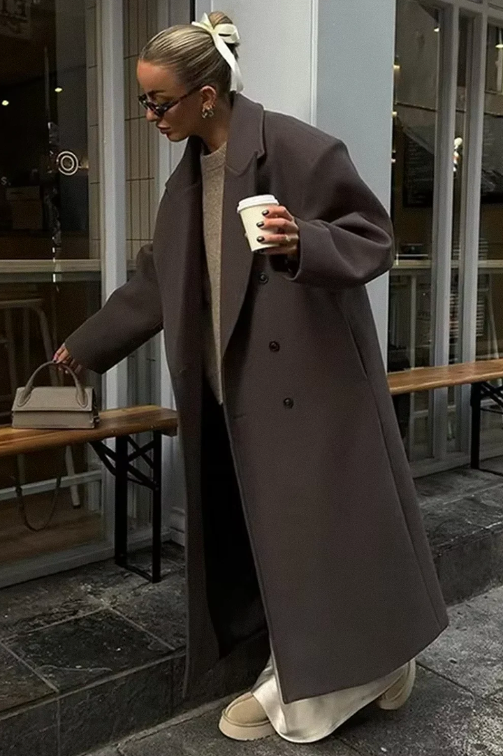 Women's oversized longline double-breasted winter coat. Stylish outerwear for fashion layering.