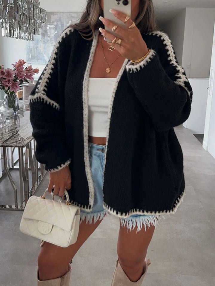 Stylish women's oversized open-front cardigan, ideal for effortless layering and cozy casual wear. Perfect for fall.