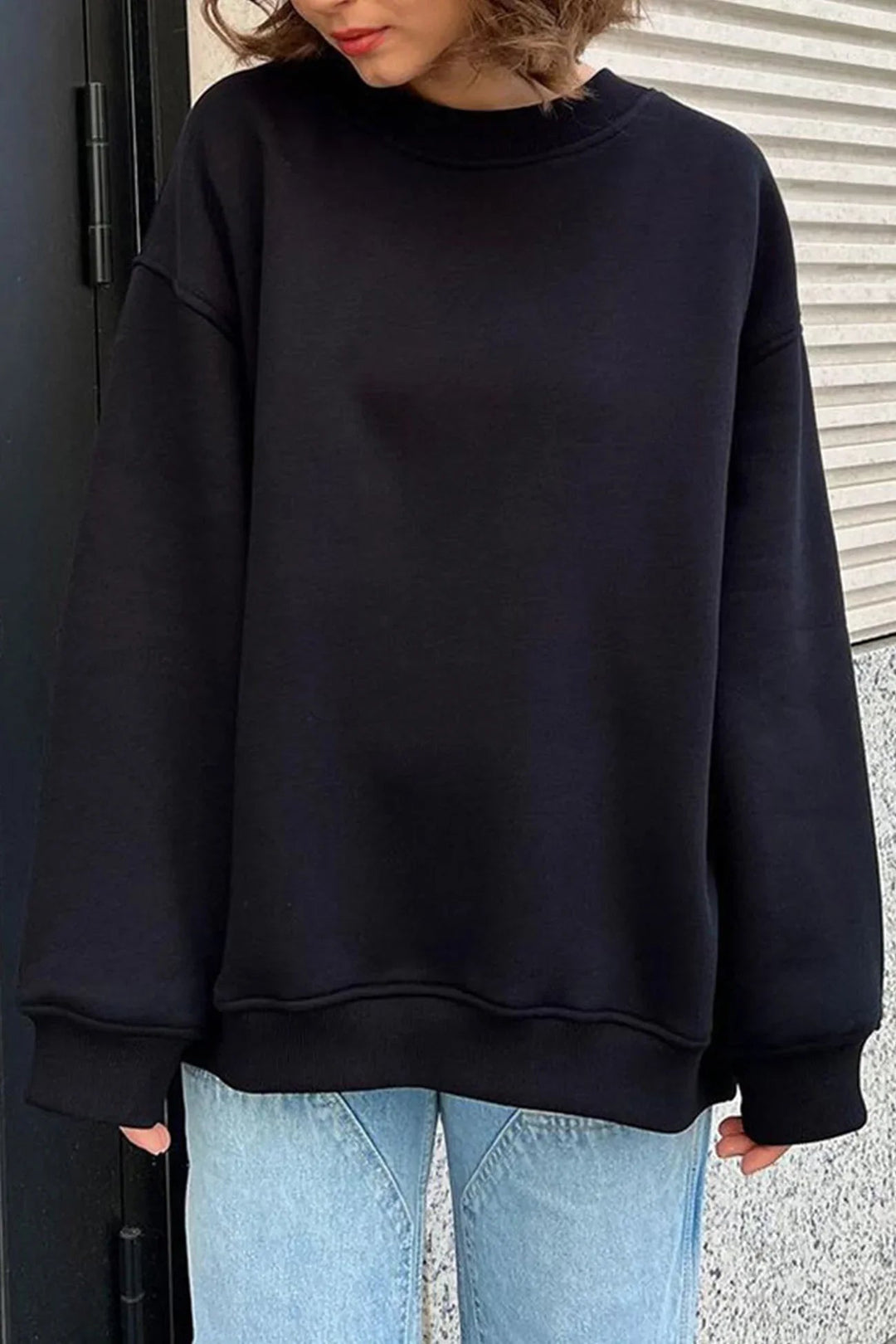 Cozy oversized round neck sweatshirt for women, a perfect winter layering piece for comfy style.