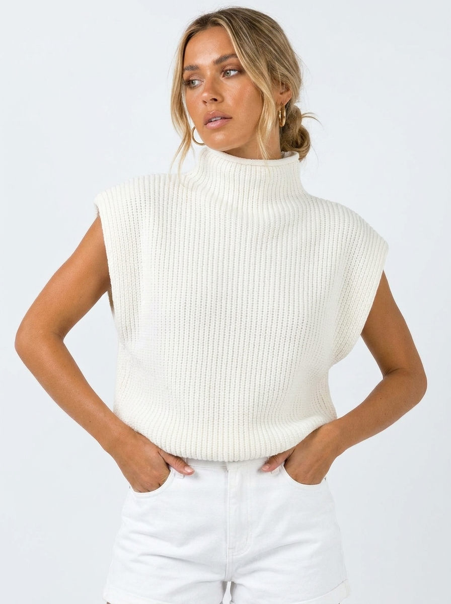 Women's oversized sleeveless high neck knitted vest for stylish fall layering.