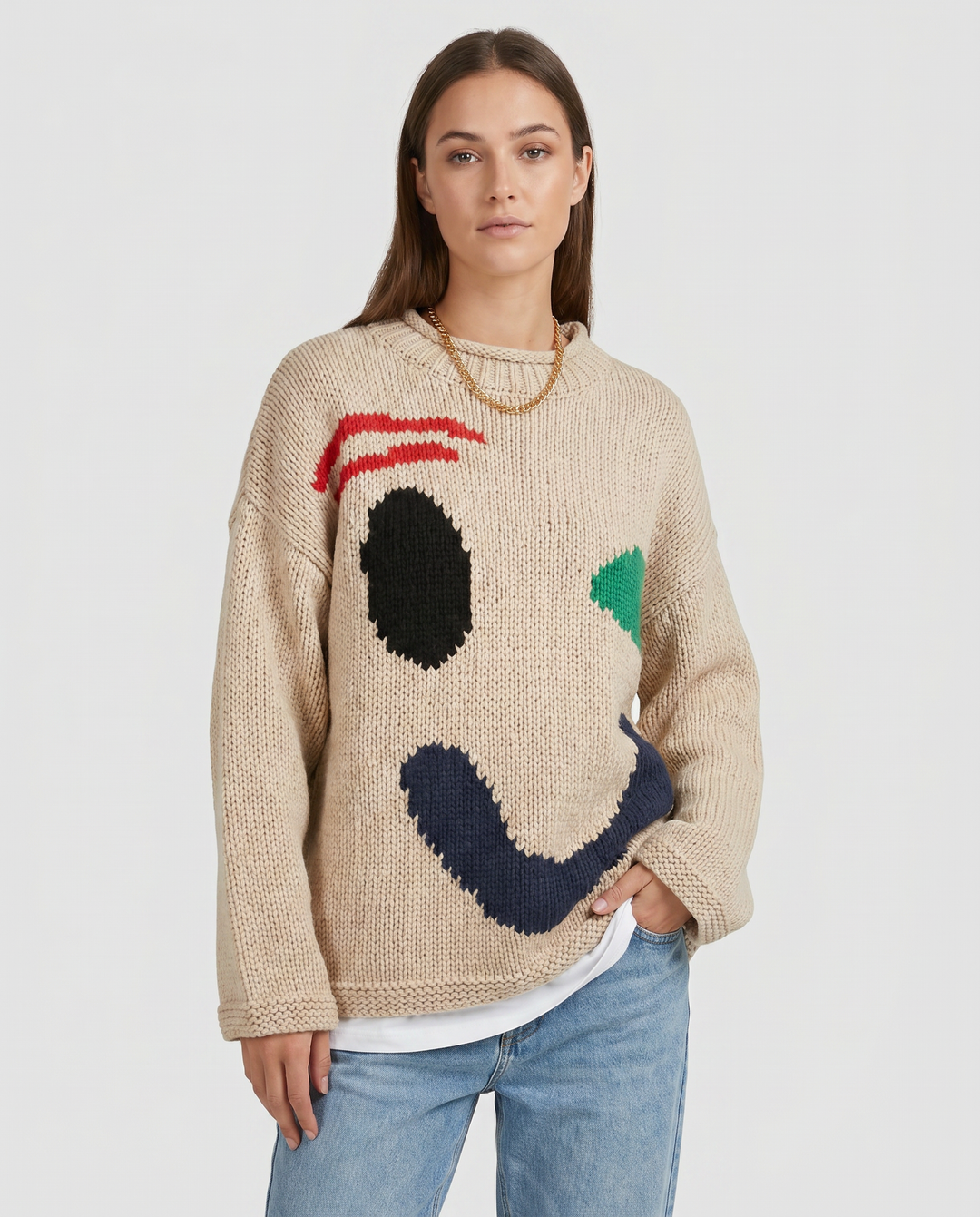 Casual women's oversized smiley face pullover sweater, soft knit for trendy autumn outfits.