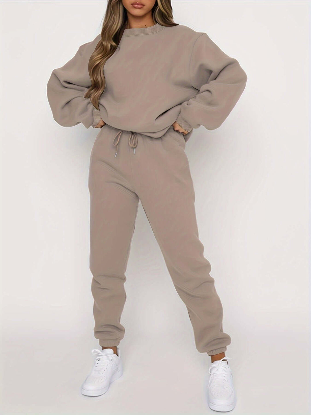 Women's oversized tracksuit, a cozy sweater and joggers set in a relaxed fit for ultimate comfort and style.