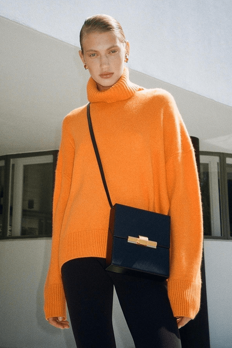 Women's oversized turtleneck knitted jumper, perfect for warm and stylish winter fashion.