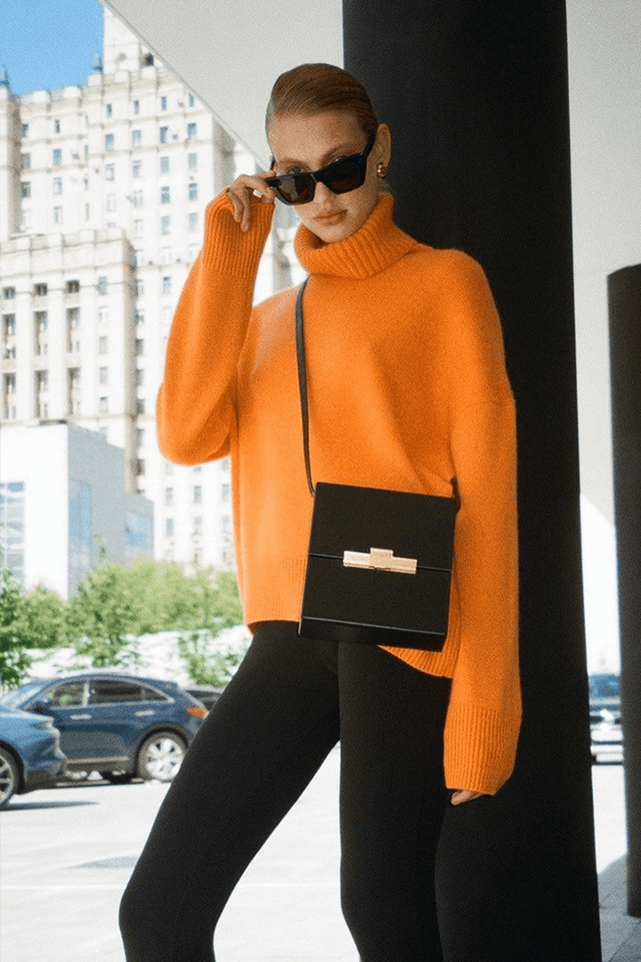 Cozy oversized women's turtleneck sweater with long sleeves, ideal for comfortable fall & winter wear.