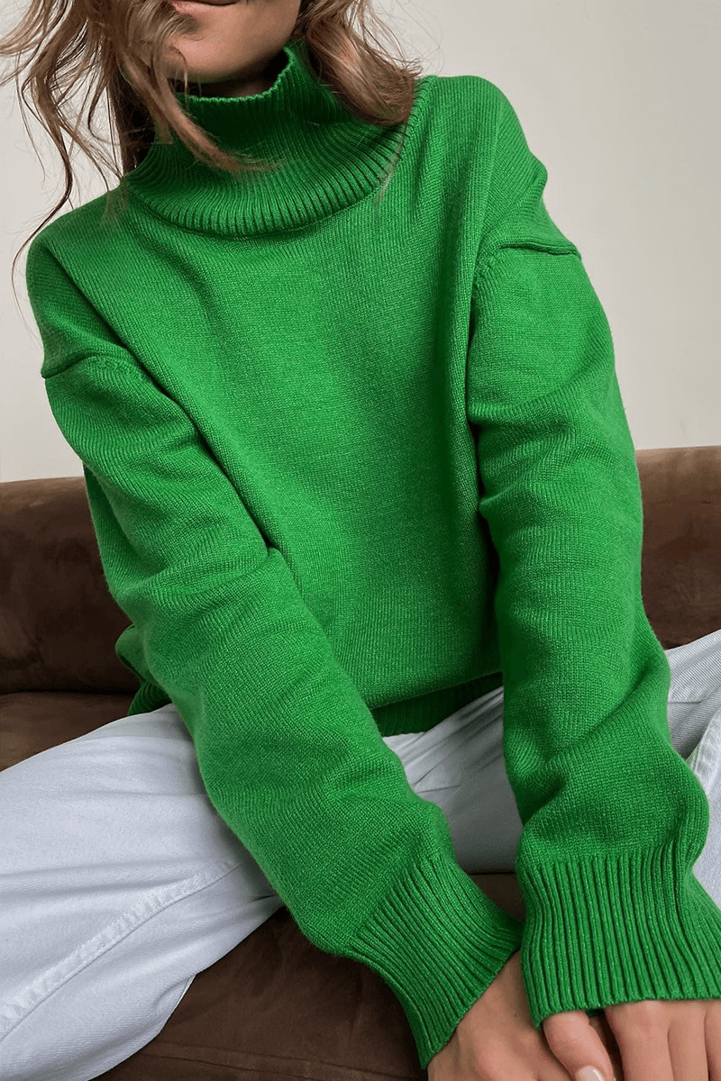 Chic women's oversized turtleneck sweater, a comfortable knitted pullover for ultimate winter style.
