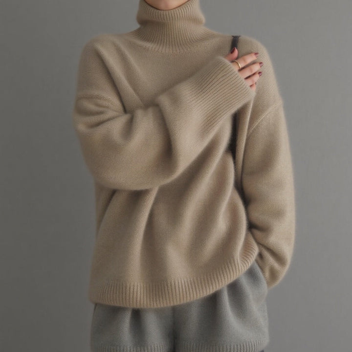 Warm women's oversized turtleneck sweater, a cozy and elegant top for stylish winter fashion.