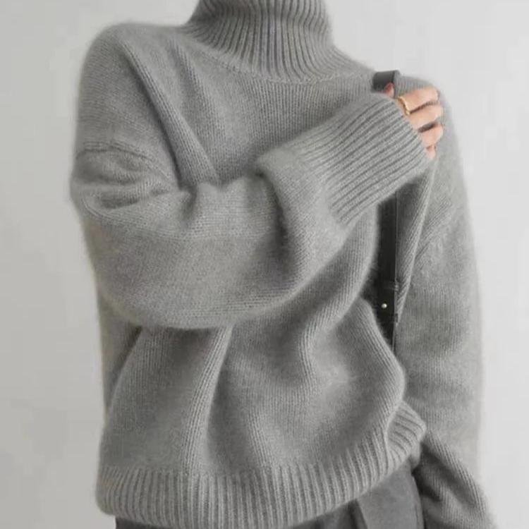 Stylish women's turtleneck sweater, oversized for a chic look, warm & cozy for winter fashion.