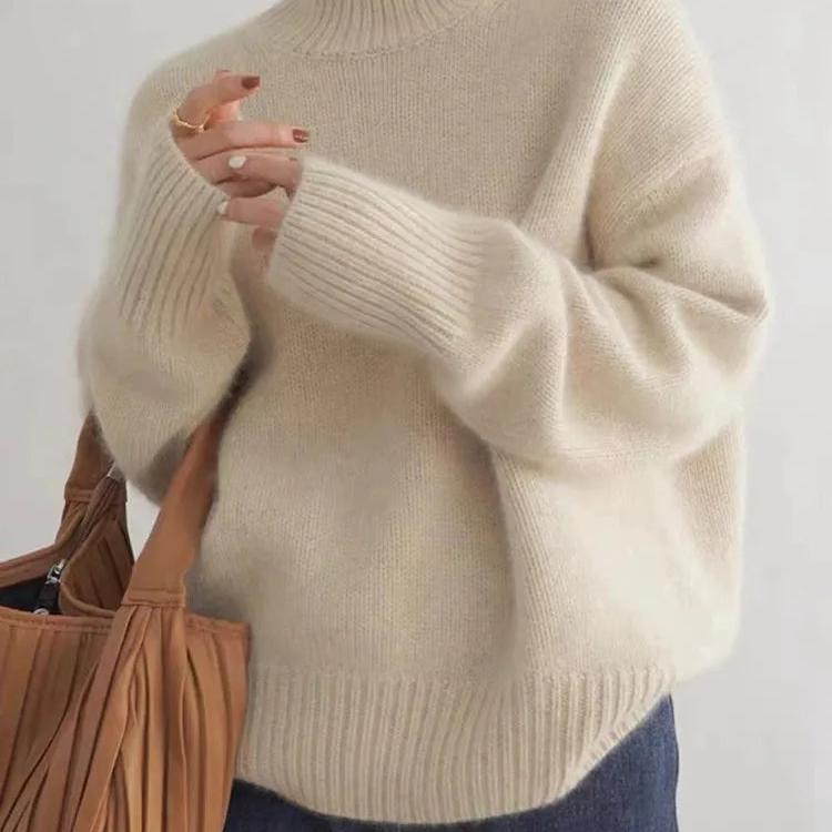 Warm women's turtleneck sweater, oversized for cozy casual comfort and elegant winter style.