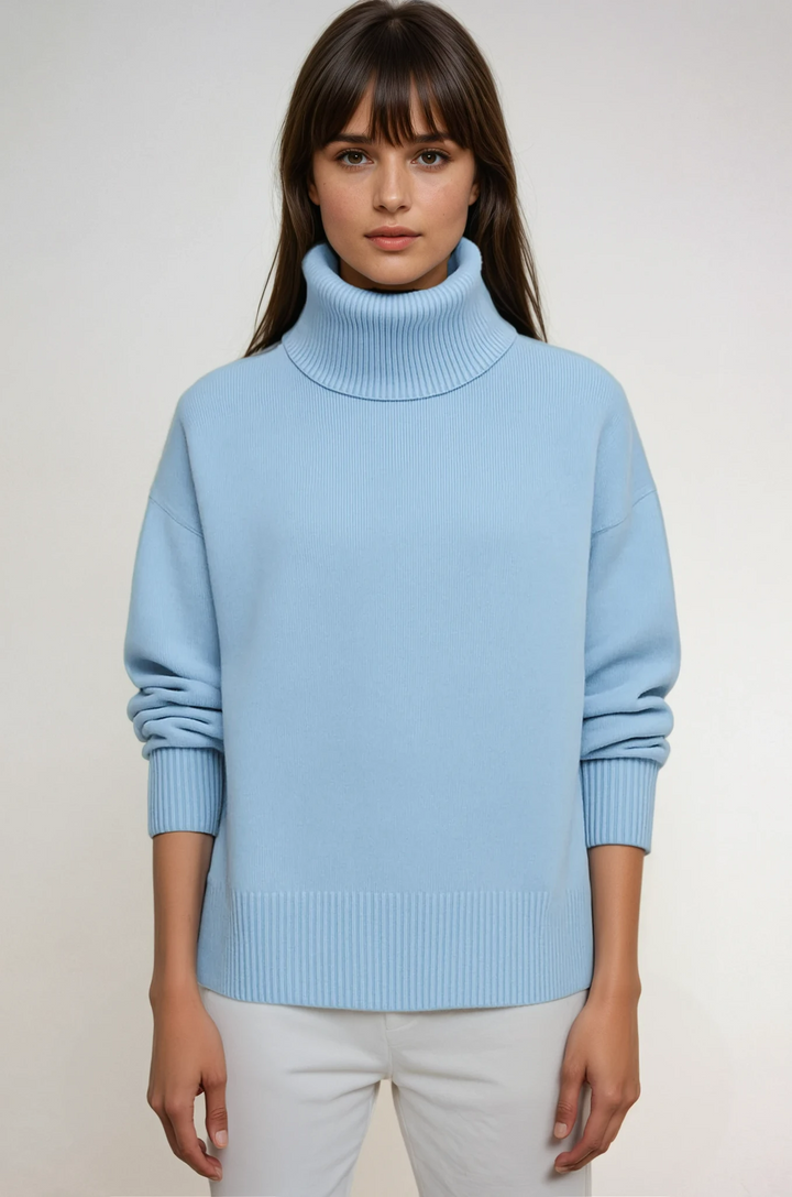 Women's oversized turtleneck sweater, cozy knit, long sleeve, for warm winter fashion.